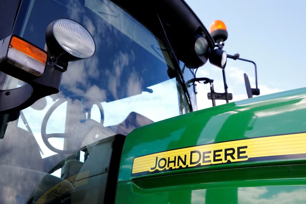 Deere posts first quarterly profit increase in three years, raises full-year forecast