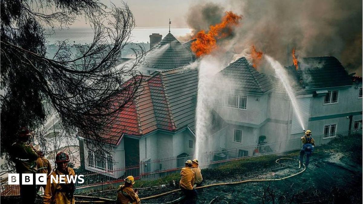 Fast-moving California wildfire burns homes as people are ordered to leave
